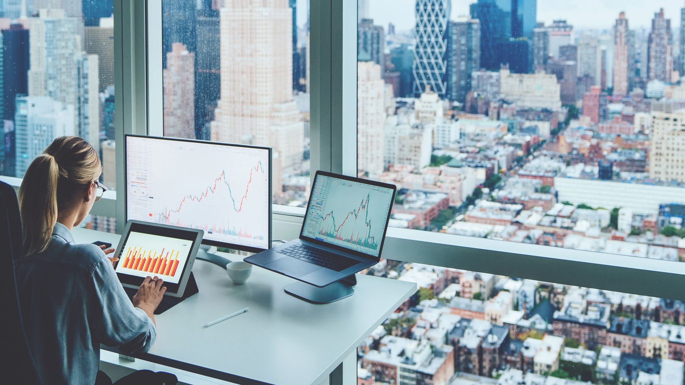 Girl in office working next to a window